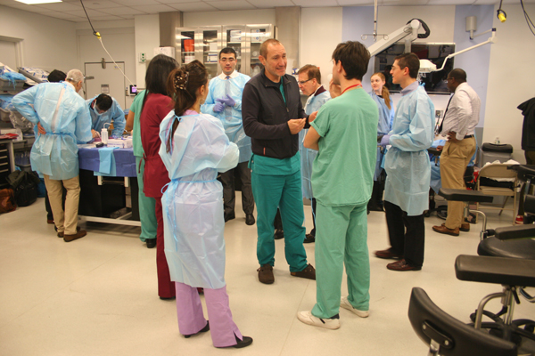 Dr. Antonio Bernardo, center, directs the Surgical Innovations Lab