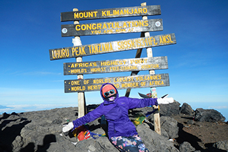 Joya at the top of Mt. Kilimanjaro.