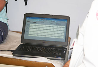 Tracey’s brain activity is stored in the Patient Data Management System, where Dr. Karceski can monitor it from afar. Here, brain waves are shown in real time as Tracey holds the wand to the implanted device.