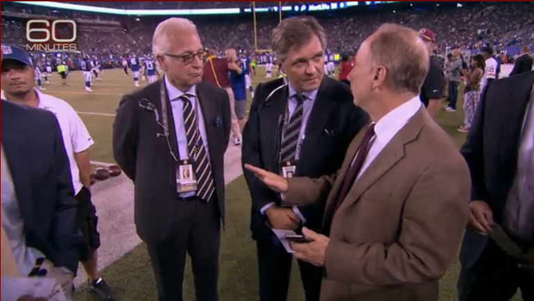 Dr. Philip E. Stieg and Dr. Roger Hartl consult on the NFL sidelines to protect players' health