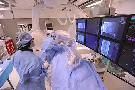 Interventional neuroradiologist performs a kyphoplasty procedure