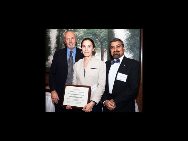 Dr. Hoffman accepts her award from Eugene J. Nowak, M.D. (left), President of the Center Alumni Council (CAC), and Vinod Malhotra, M.D., who is Chair of the CAC’s Awards and Nominations Committee and was the 2013 recipient of the Outstanding Service Award.