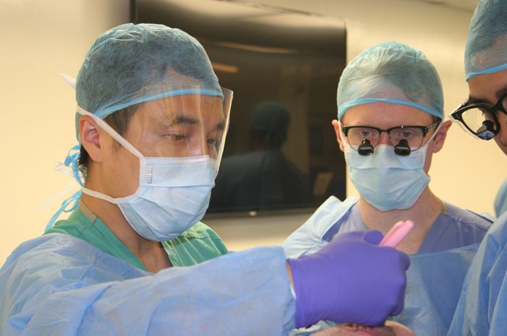 Dr. Ning Lin guides residents at a cranial station