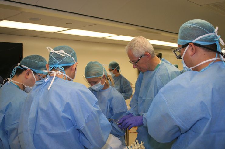 Dr. Elowitz oversees residents beginning dissection
