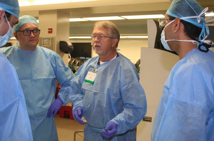 Dr. Hartl starts at a model table before moving to a dissection station