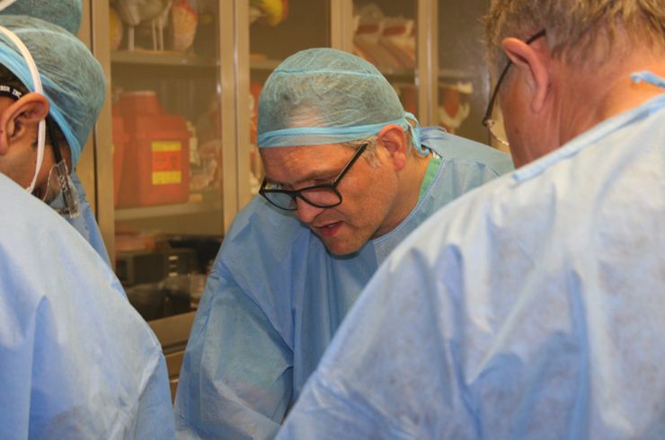 Dr. Hartl directing students at a spine station