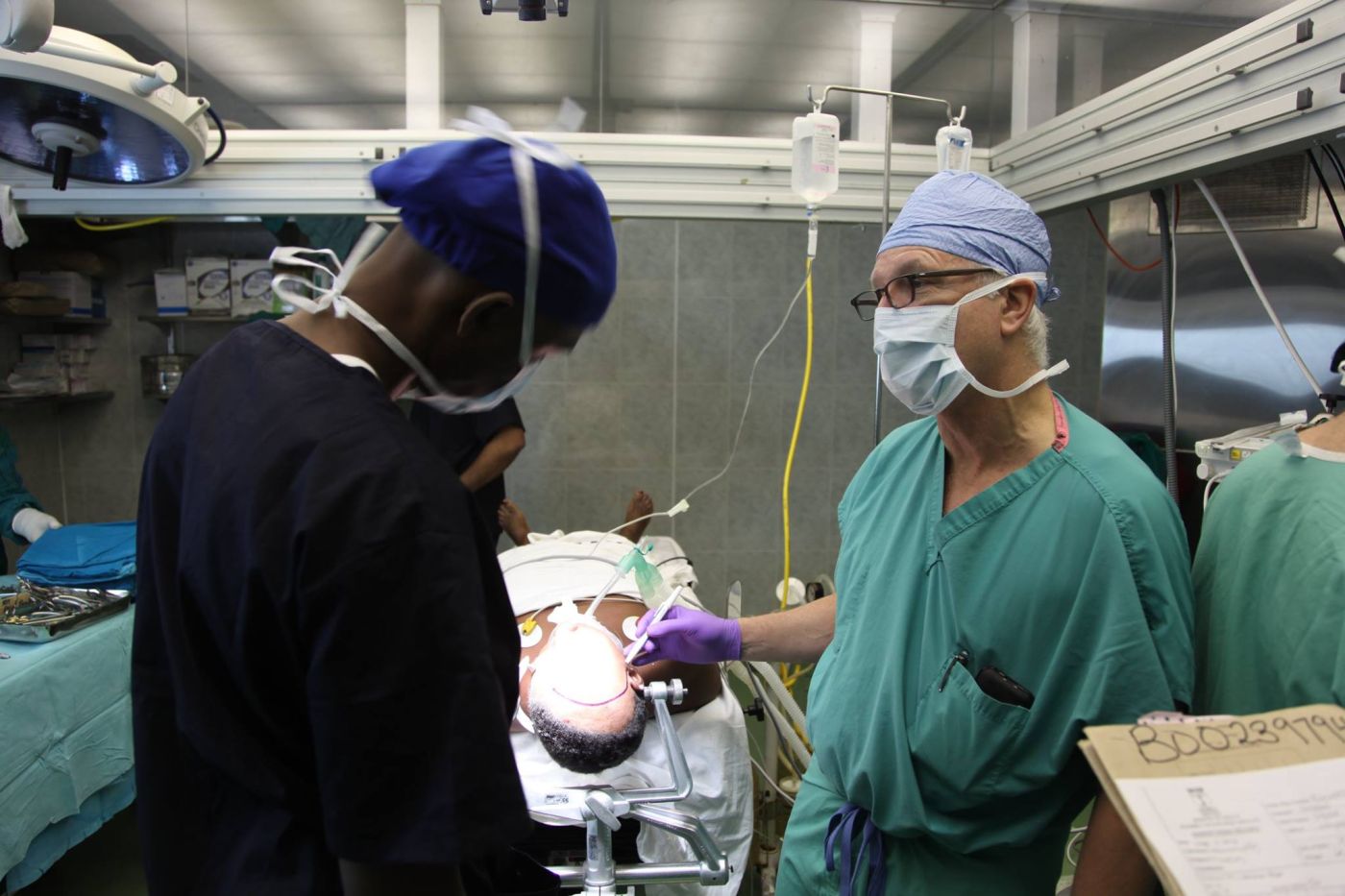 Dr. Stieg prepares the local team for surgery, Tanzania 2014