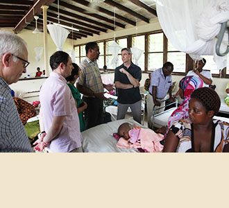 Day 3: Dr. Stieg and Dr. Greenfield confer with the family of a young hydrocephalus patient