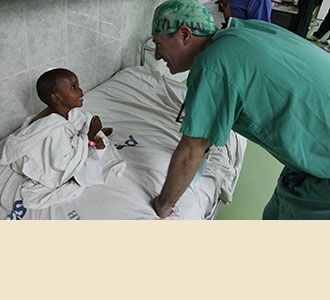 Dr. Greenfield charms his patients despite language barriers