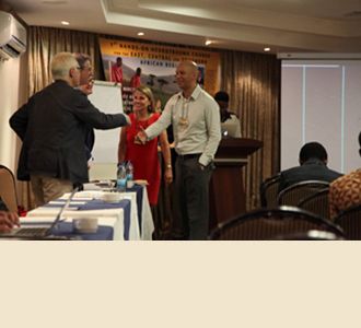 Dr. Philip Stieg (left) and Dr. Roger Härtl greet Karen March from the USA and Dr. Anthony Figaji from South Africa.