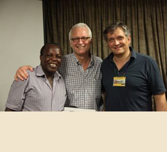 Dr. Joseph Kahamba (left), Dr. Stieg, and Dr. Härtl celebrate at the end of a successful course.