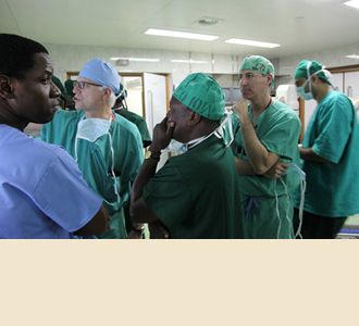 Drs. Stieg, Kahamba, and Greenfield review images.