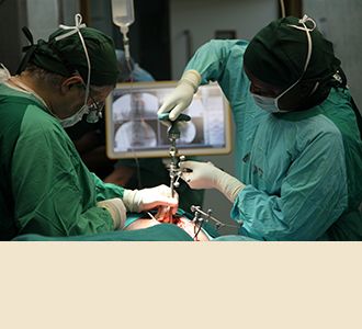 First minimally invasive spine procedure done in Tanzania: Dr. Härtl begins the procedure by establishing reference marks alongside with a resident.