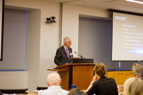 Dr. Eric Elowitz prepares to introduce his colleague, Dr. Walter Johnson