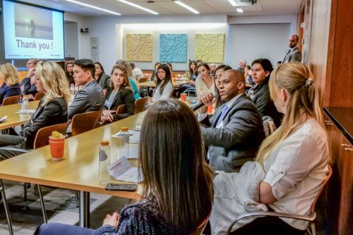 Attendees ask questions to speakers to learn more