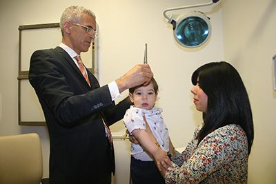 Dr. Souweidane takes measurements in two directions