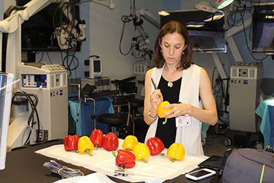 Dr. Hoffman prepares peppers for the students