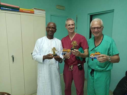 Dr. Seydou Badiane, chairman of Fann Hospital&#039;s neurosurgery program, Dr. Greenfield and Dr. Stieg